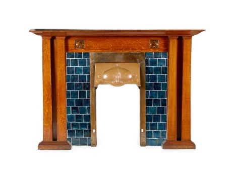 ENGLISH ARTS & CRAFTS FIREPLACE, CIRCA 1910 oak, patinated copper with repoussé copper panels, cast iron and glazed ceramic t