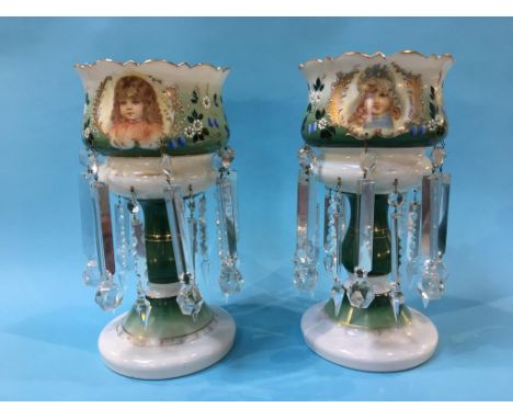 A pair of Victorian opaque glass lustres, decorated with a portrait of children and flowers, with gilded highlights, 36cm hig