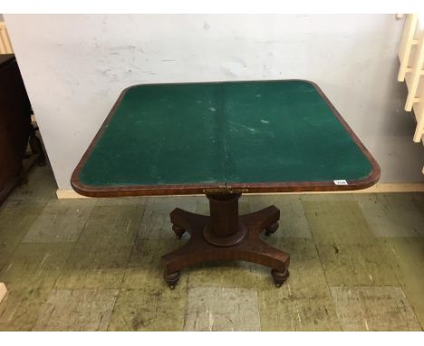 A 19th century mahogany fold over card table