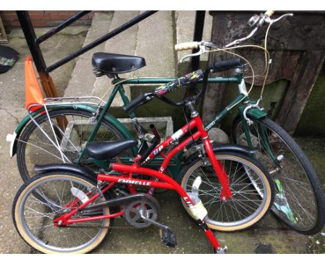 A vintage Puch bike and an Emmelle bike with tandem attachment