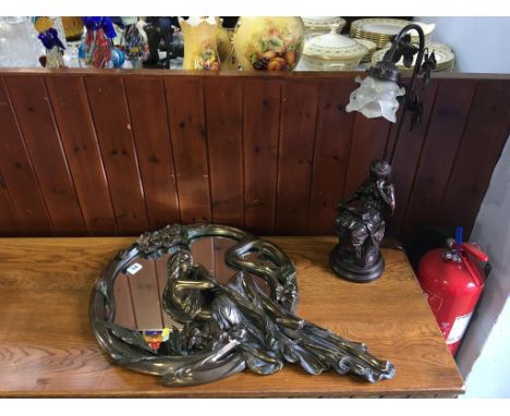 An Art Nouveau style mirror and a table lamp