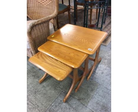 A light oak nest of tables