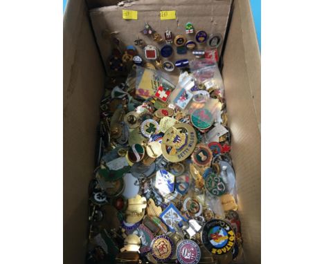 A collection of bowling enamel badges