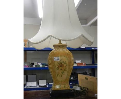 A ceramic table lamp with shade.