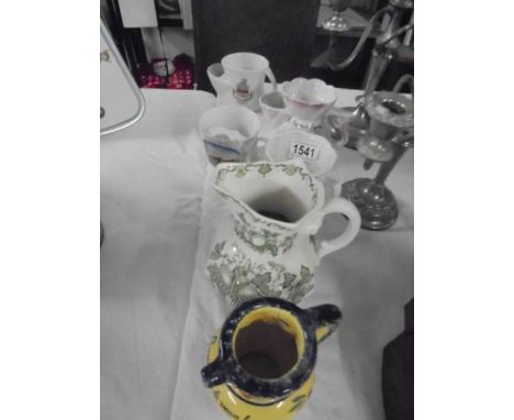 A quantity of ceramic jugs.