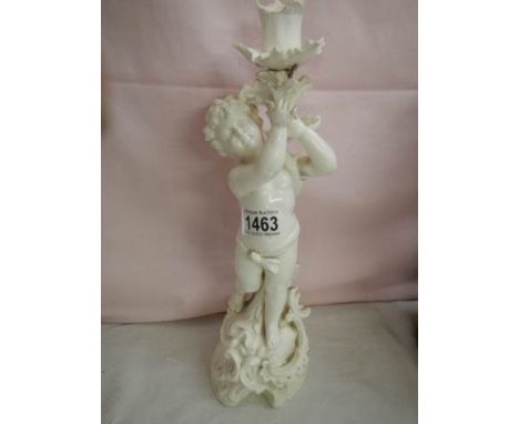 An antique porcelain cherub candleholder, a/f.