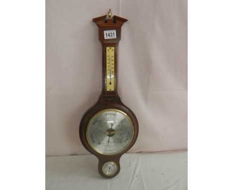 A 20th century mahogany barometer.