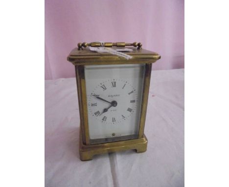 A brass carriage clock.