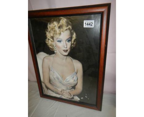 A framed and glazed portrait print of Marilyn Monroe.