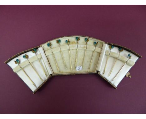A cased set of twelve silver gilt and enamel cocktail sticks the finials in the form of cockerals - Birmingham 1931
