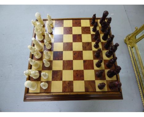 Walnut games table with composite figure chess pieces and revealing baize backgammon board when top is removed - tallest piec