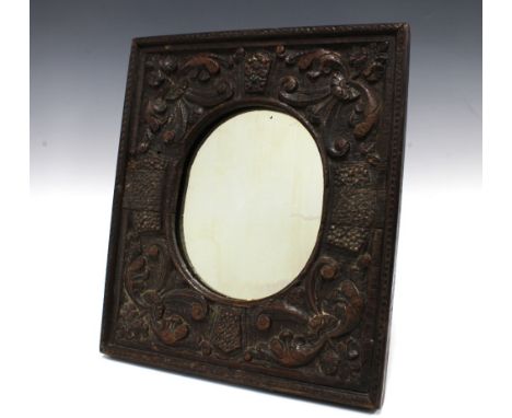 Antique carved oak oak frame containing an oval mirror, 32 x 37cm (easel strut back a/f)