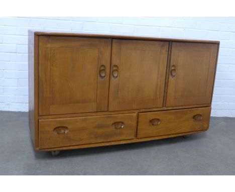 An Ercol Windsor elm sideboard, , 130 x 76 x 50cm.