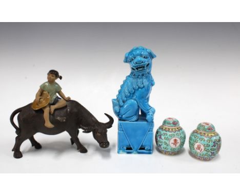 Chinese turquoise glazed fo lion dog on base, 20cm, together with a pottery figure of a girl on a water buffalo, and two smal