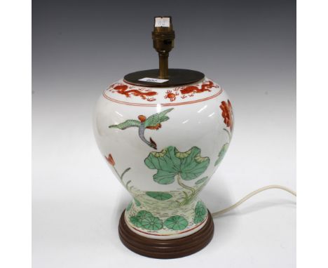Chinoiserie table lamp painted with water lillies, on wooden base with brass fittings, 34cm