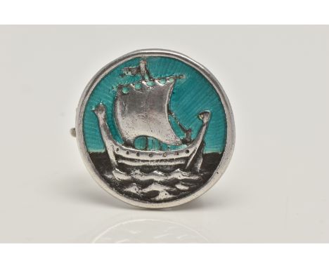 AN IONA BROOCH BY ALEXANDER RITCHIE, of circular outline depicting a Viking ship with guilloche enamel sky background, stampe