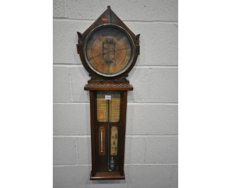A ROYAL POLYTECHNIC ADMIRAL FITZROY BAROMETER, by Joseph Davis &amp; Co Fitzroy Works, the oak case with an arched surmount, 