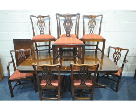 A RACKSTRAW MAHOGANY TWIN PEDESTAL DINING TABLE, with three additional leaves, extended length 321cm x closed length 183cm x 