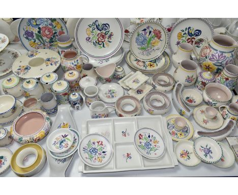 A QUANTITY OF POOLE POTTERY TRADITIONAL WARES, over sixty pieces of mainly floral painted pottery, with a couple of pieces pa