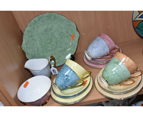 A TWENTY ONE PIECE ROYAL ALBERT GOSSAMER TEA SET, comprising a cake plate, a cream jug, a sugar bowl, and six each of teacups