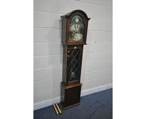 AN OAK CHIMING LONGCASE CLOCK, the brass dial with moonphase movement, Roman numerals, and chiming lever, height 180cm (condi