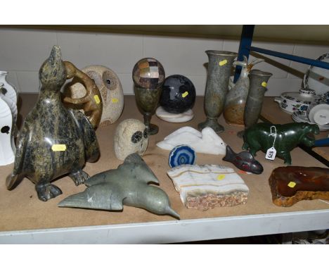 A COLLECTION OF STONE ITEMS, to include three carved Canadian birds, a jug and goblet, two vases tallest 27cm, a heavy globe,