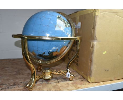 A BOXED TABLE TOP GLOBE, marine blue gemstone globe with a brass coloured stand, three feet and central compass in the base, 