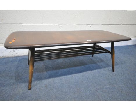 A MID CENTURY ERCOL COFFEE TABLE, with a spindle undershelf, length 106cm x depth 44cm x height 36cm (condition report: surfa