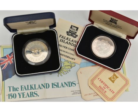 TWO CASED SILVER COINS, the first a Falkland Island 150th anniversary coin, an Tercentenary Crown coin, both with written inf
