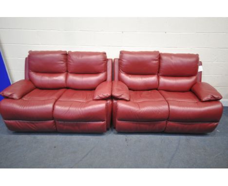 A RED LEATHER TWO PIECE RECLINING LOUNGE SUITE, comprising of two two seater settee, one electric and one manual, length 141c