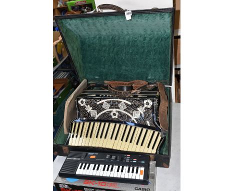 A CASED SCANDALLI SCOTT WOOD FOUR ACCORDIAN, body straps detached and worn, hand strap in good condition
