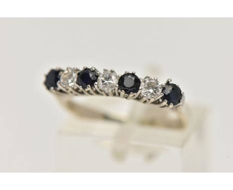 AN 18CT WHITE GOLD DIAMOND AND SAPPHIRE RING, designed as a row of four circular sapphires interspaced by three brilliant cut