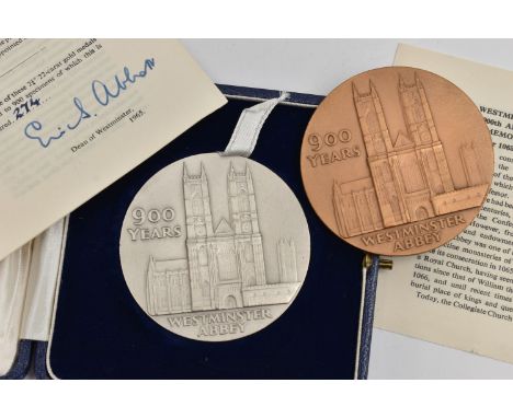 TWO WESTMINSTER COMMEMORATIVE MEDALS, the first a cased silver 900th anniversary medal, hallmarked London, approximate gross 