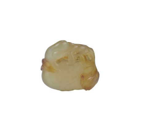 A 19th century Chinese light and dark brown Agate pendant carved as a Duck holding a lotus branch in it's beak. 4cm x 3cm. Pu