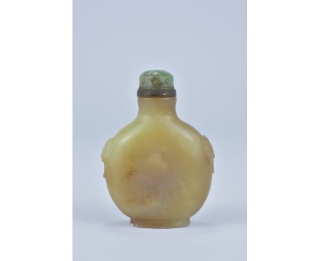 A Chinese 19th century yellow and brown Jade Snuff Bottle with jade stopper. 7cm tall. Purchased between 1972-74 - valued by 