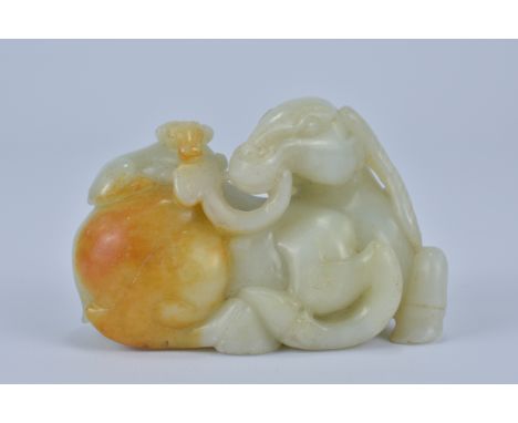 A Chinese carved Celadon and russet Jade Ram. 10cm x 6cm