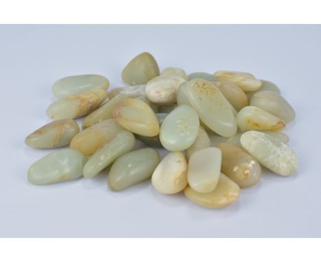 A group of thirty-two natural Jade stone pebbles&nbsp;(32)