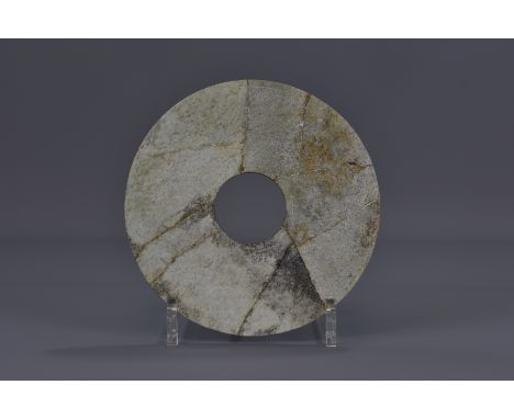 A Chinese Han Dynasty jade disc. 17cm diameter