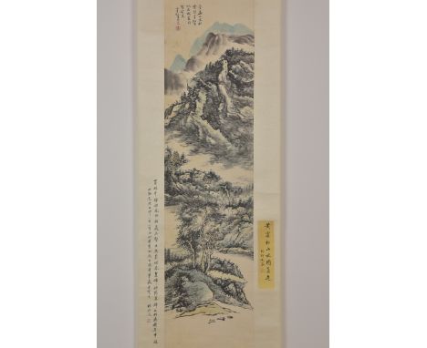 A Chinese 20th Century watercolour painting on paper in scroll of mountain and river scene. With various inscriptions signed.