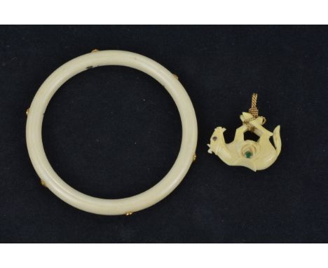 An Ivory Bangle inserted with 18k gold (stamped) with six sapphire stones in gold mounts together with an Ivory Horse Pendant