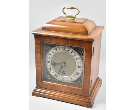 A Good Quality Walnut Cased Mantle Clock with Domed Top and Brass Carrying Handle, with Key and Working, 26cm high 