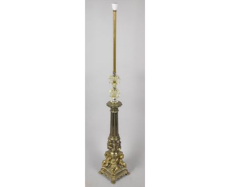 A Mid 20th Century Brass and Glass Standard Lamp with Reeded Support on Cherub Base 