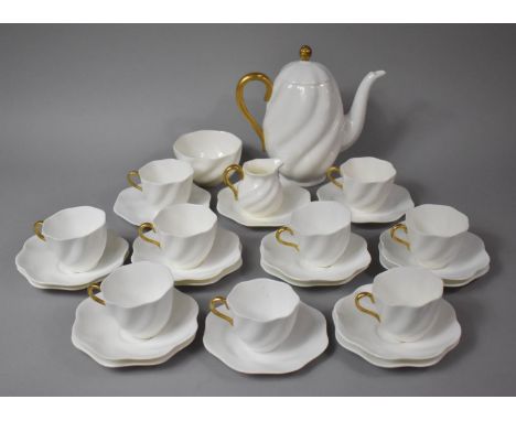 A Coalport White and Gilt Decorated Tea Set to comprise Nine Cups, Six Saucers, Ten Side Plates, Tea Pot, Sugar Bowl and Milk