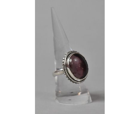 A Silver and Amethyst Cabochon Ladies Dress Ring 