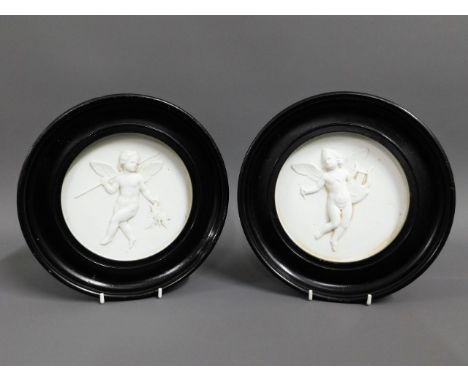 A pair of Bing &amp; Grondahl Royal Copenhagen mounted porcelain plaques with relief cherub decor, 8in diameter