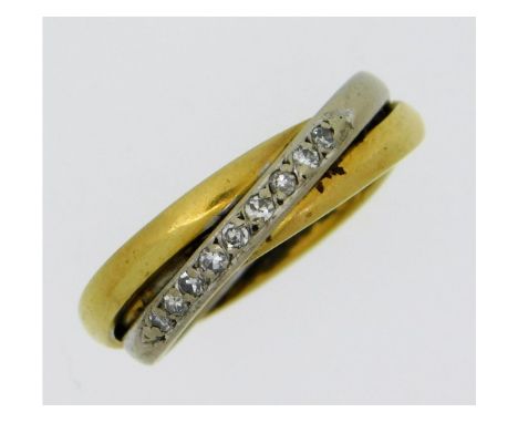 An 18ct two colour gold ring set with nine small diamonds of approx. 0.18ct, 7.9g size M/N