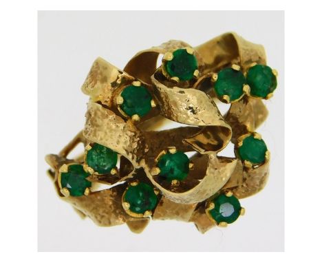 A 9ct gold ring set with ten emeralds of 3mm diameter, 6.38g, size P