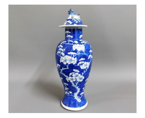 A 19thC. Chinese lidded prunus baluster vase with foo dog finial, small chip to dog tail, four character mark to base, possib