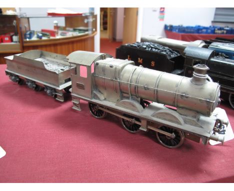 An "O" Gauge/7mm Tin/White Metal and Brass 0-6-0 Collett Class Locomotive and Tender, electric motor, unpainted, unfinished.