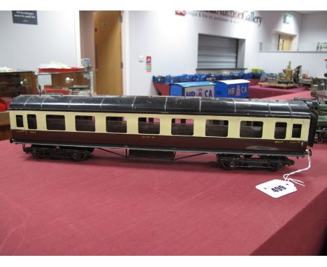 An "O" Gauge/7mm Eight Wheel Coach, finished in GWR brown and cream, one side window loose.
